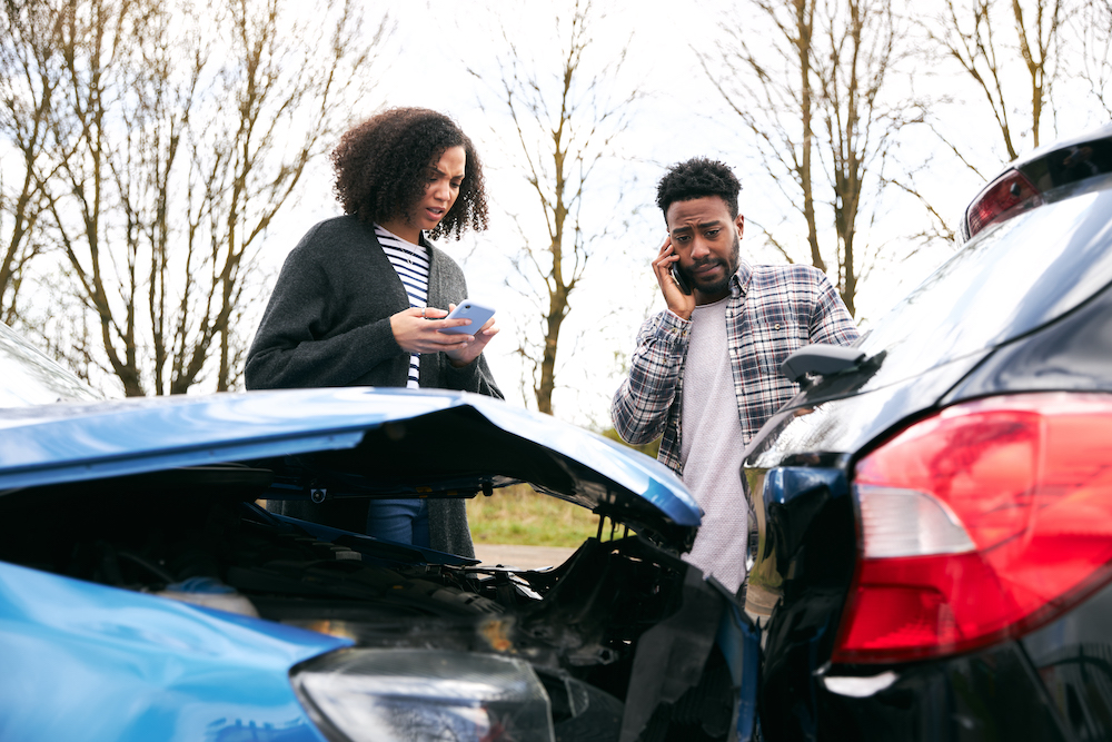 Two people before a car accident lawsuit in Kansas City.