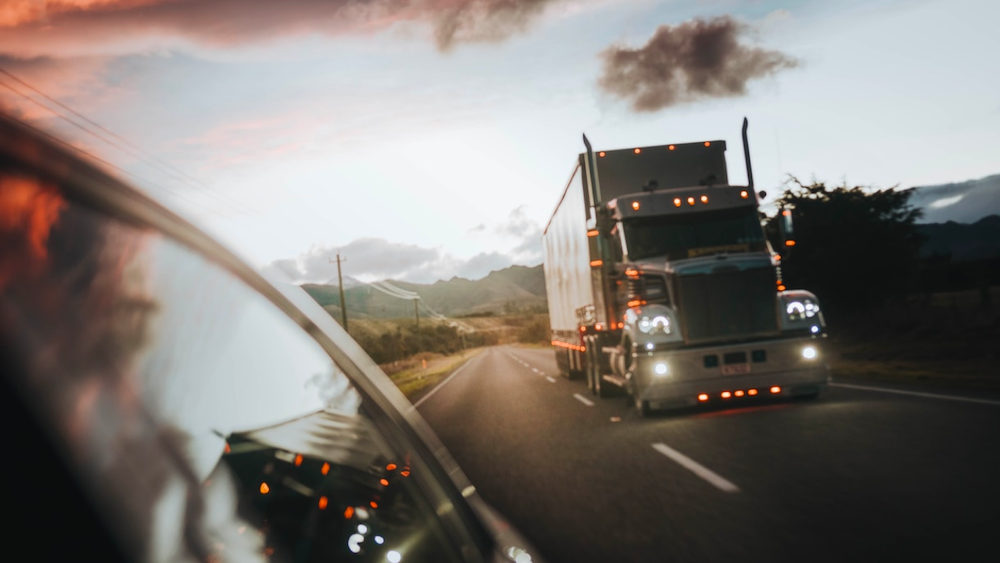 A view from a driving vehicle of a semi-truck on the highway before a truck accident litigation in Kansas City