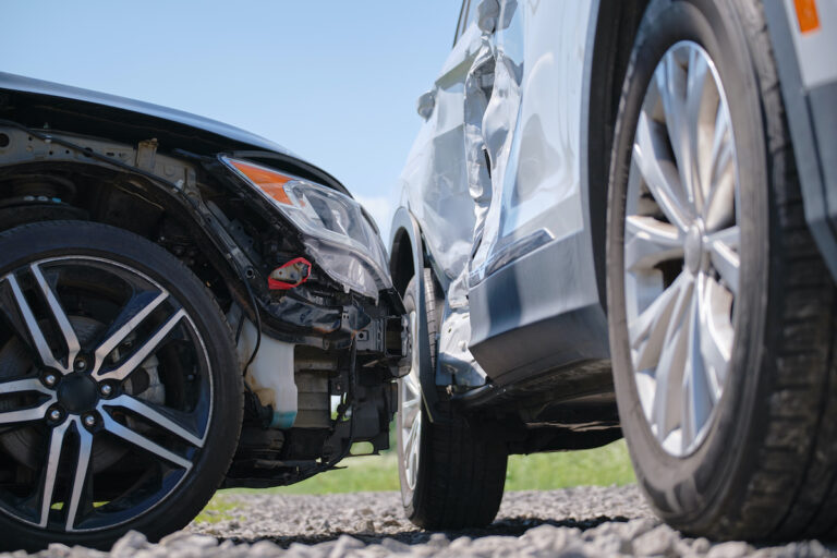 Side shot of 2 cars after accident to emphasize the need for a rideshare accident attorney in Kansas City